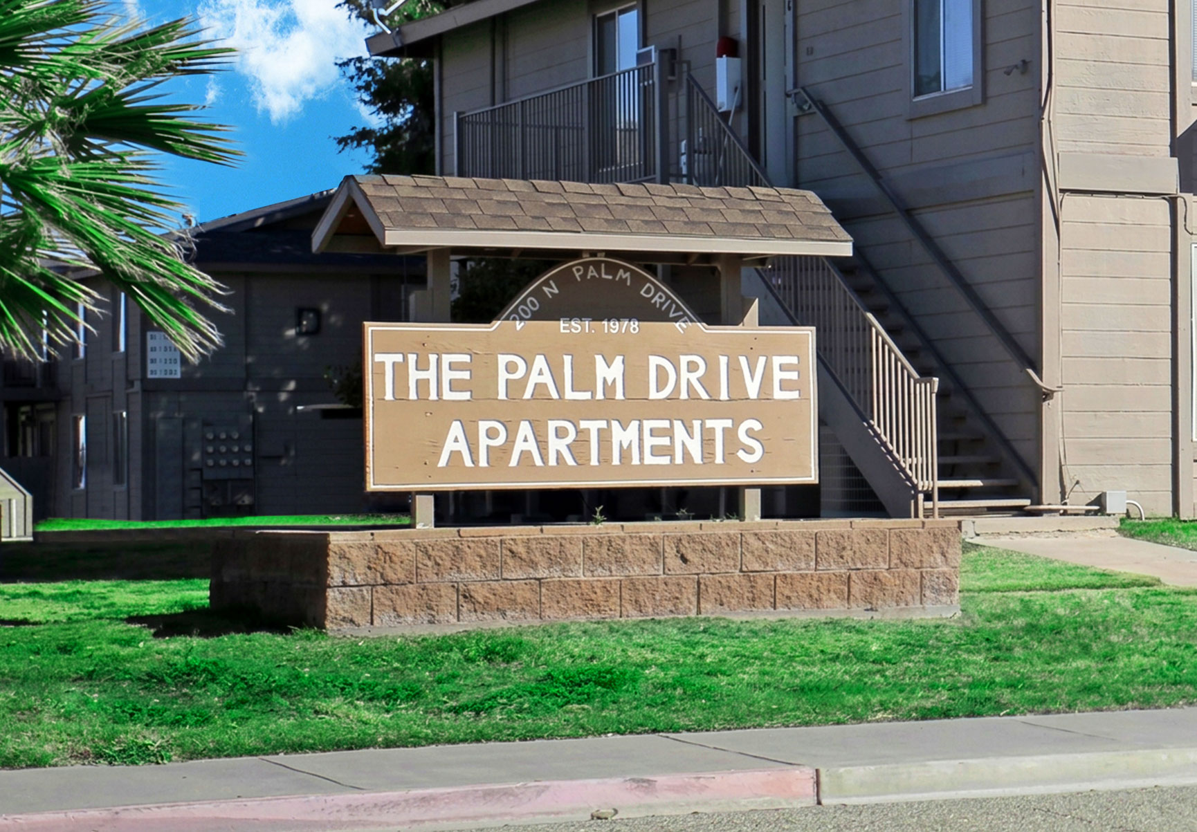 This image displays entrance marker photo of Palm Drive Apartments